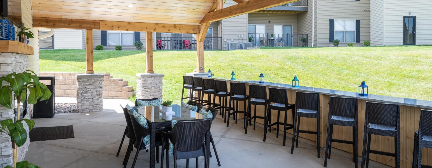 a patio with tables and chairs