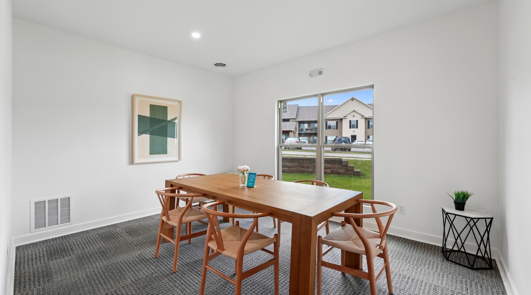 a table with chairs in a room